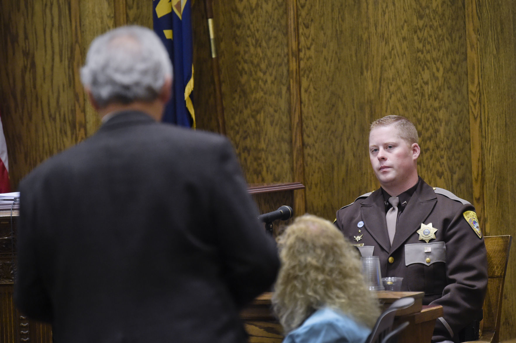 Lewis and Clark County Sheriff's Deputy Andrew Blythe, 29, left, responds to questioning